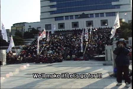 Workers mass meeting on the steps of Korea Telecom