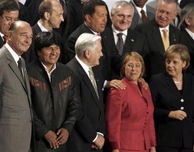 Here he laughed with Hugo Chavez & South America as  Mr Europe at a Brazilian gogo girl doing a Greenpeace stunt.