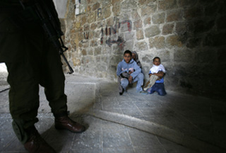 dngerous Terrorist kiddies photographed in the act of existentially terrorising innocent harmless Israeli soldier
