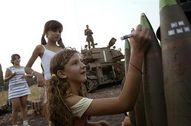Israeli children in Kiryat Shmona leaving messages on missiles meant for Lebanon, 2006.