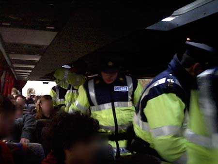 cops searching the grassroots bus