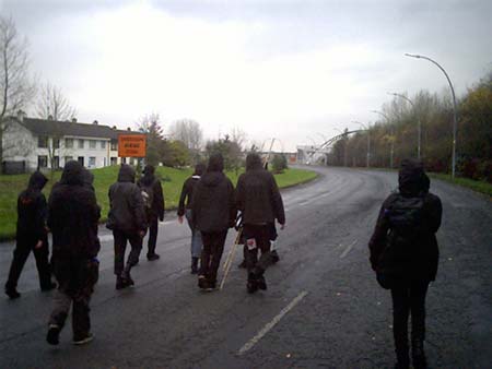 black bloc'ers walking to the police line