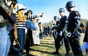 one of those historic "flower power" moments in California protesting the Vietnam war. The girl offers the soldier a flower.