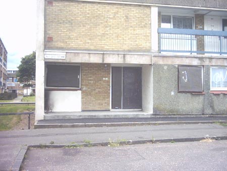 Click on image to see full-sized version Boarded up... depressingly familiar to back home.