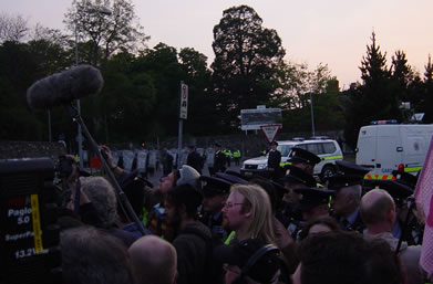 While a small exchange of views occurs in the centre of the demo, which has about 15 camermen fighting to watch, the riot squad start sneaking in from the left
