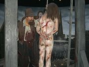 A dangling Guy Fawkes, the wax version in Madame Tussaud's museum. His buddies' heads are displayed on pikes