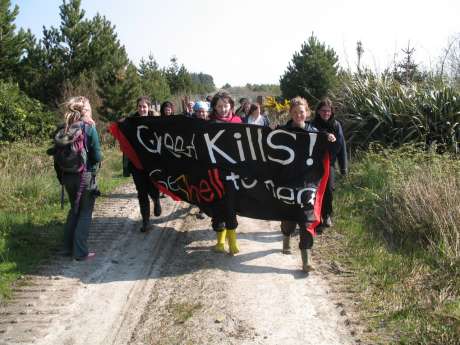 Women march to the inner compound through the site. 