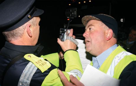 Willie Corduff appeals to a Gardawho is filming at the daily pre-dawn protest close to Shell's proposed gas refinery at Bellanaboy, Co Mayo, October 2006