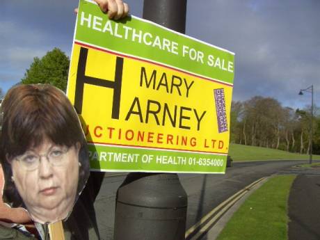 Mary Harney Puts poster on pole