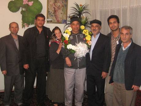 Ebrahim Madadi celebrates his release with his family and union members. 
