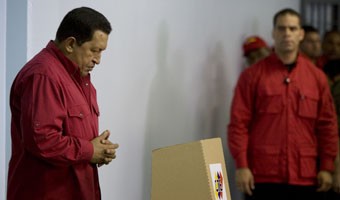 Hugo Chavez strikes a prayerful pose after voting in the referendum which confirms he may not stay legally in office after 2013