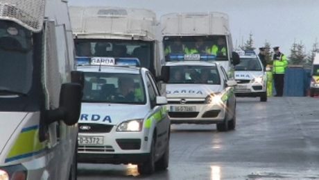 Garda Vehicles follow protesters to main gate