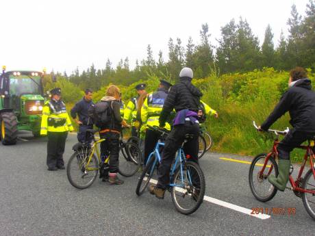 Guards telling cyclists to clear the road