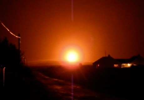 Courtesy MayoNews -LIKE THE SUN A still image taken from a recording shows the glow from the flaring at the Corrib Gas terminal on New Years Eve.