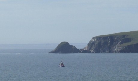 See the Irish naval service boat near the headland