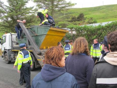 Campaigner dangerously being removed from on top of a truck