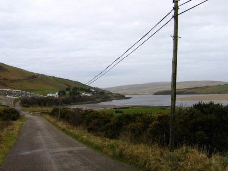 The road from Pollatomish to Glengad, with the cemetery on the left