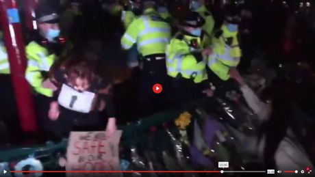 Woman prevented by police from laying flowers at vigil