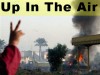 An Iraqi child flashes a victory sign as a U.S. Bradley fighting vehicle is seen burning in Baghdad, Iraq (Monday, Nov. 28, 2005)