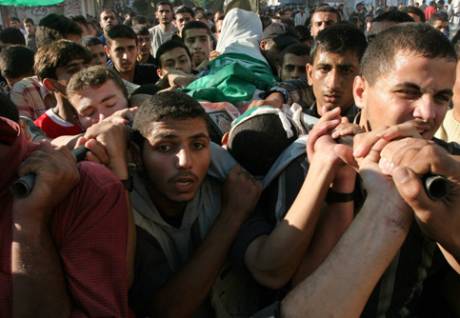 Palestinians carry the body of 21-year-old Bassem al-Jammal during his funeral in Gaza City, 2 November 2006. Al-Jamal was a Hamas activist killed by Israeli forces. (MaanImages/Wesam Saleh)