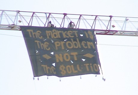 "Markets are the problem, not the solution" Banner drop at closing day of Barcelona climate talks