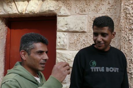 Zakaria Zubeidi on right with head of Bilin's Popular Committee Iyad Burnat