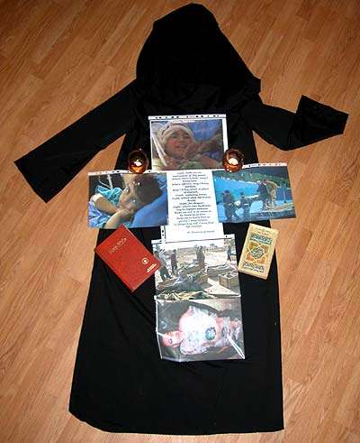 Shrine and Burqa with Bible and Qu'ran, Photos off Iraq War Casualties