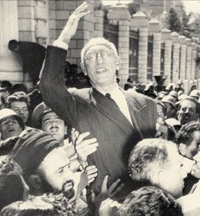 Iranian Prime Minster Mohammad Mosaddeq being carried away by supporters outside the parliament building after an address on oil nationalization. (Copyright 2003, AP/Wide World Photos)