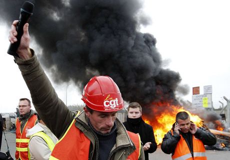 Oil worker and union representative Christophe Hiou delivers a speech as workers protest near the oil refinery in Donges, near Nantes