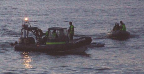 Garda sandwich S2S activists between ribs - 3. S2S boat crew in water and cops in after them.