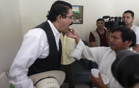today's image reminded me of Saddam Hussein's dental check when the US caught him. But Pres Z. is in fact taking a holy communion euchuristic wafer & some water.